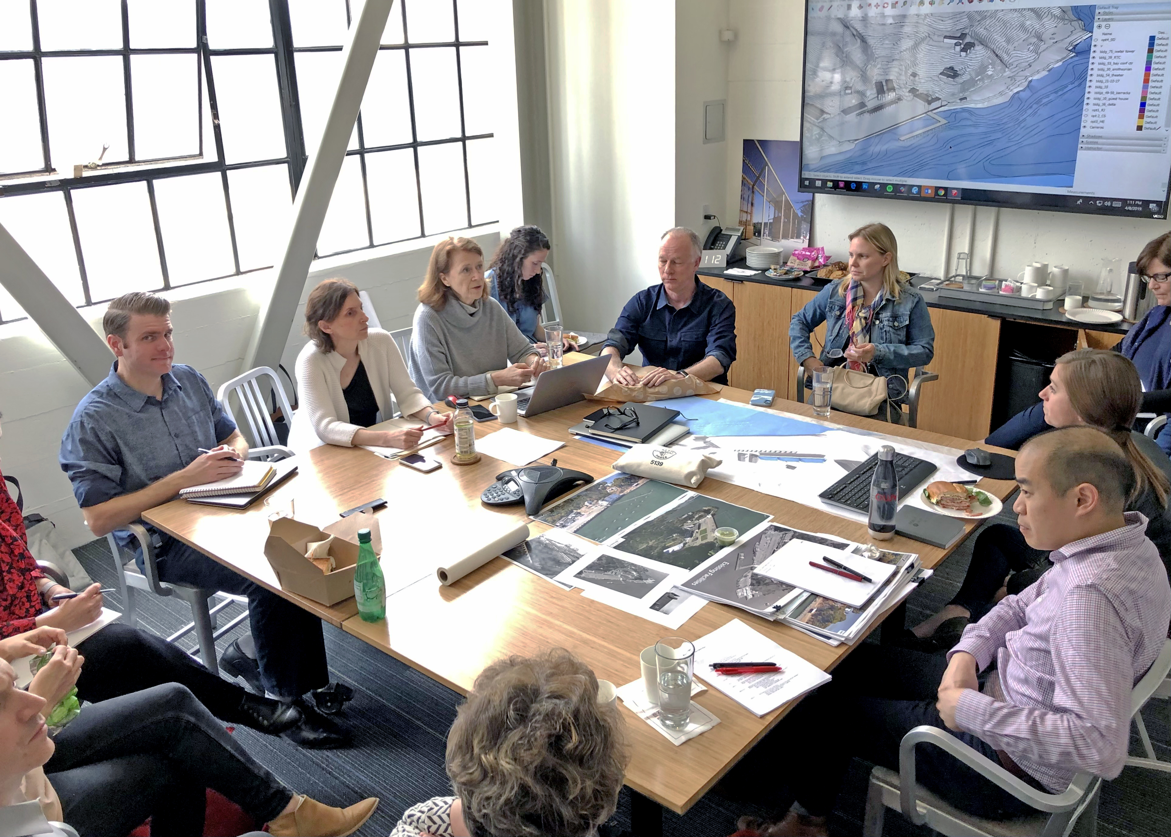 A working group and design team at a project meeting