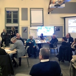 people sitting on chairs in a room